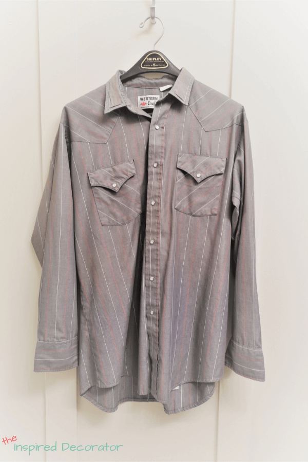 Grandpa's everyday collared shirt featuring red and white pinstripes on a medium grey fabric. This shirt is being used to create a keepsake memory pillow.