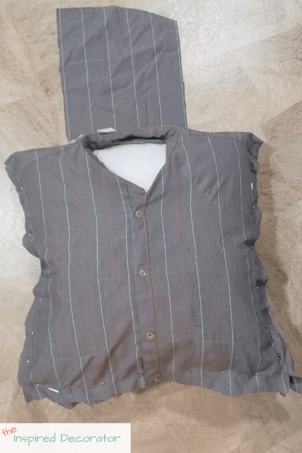 Use a large piece of the scrap fabric to create a cover for the neck area of the shirt and hide the pillow insert.