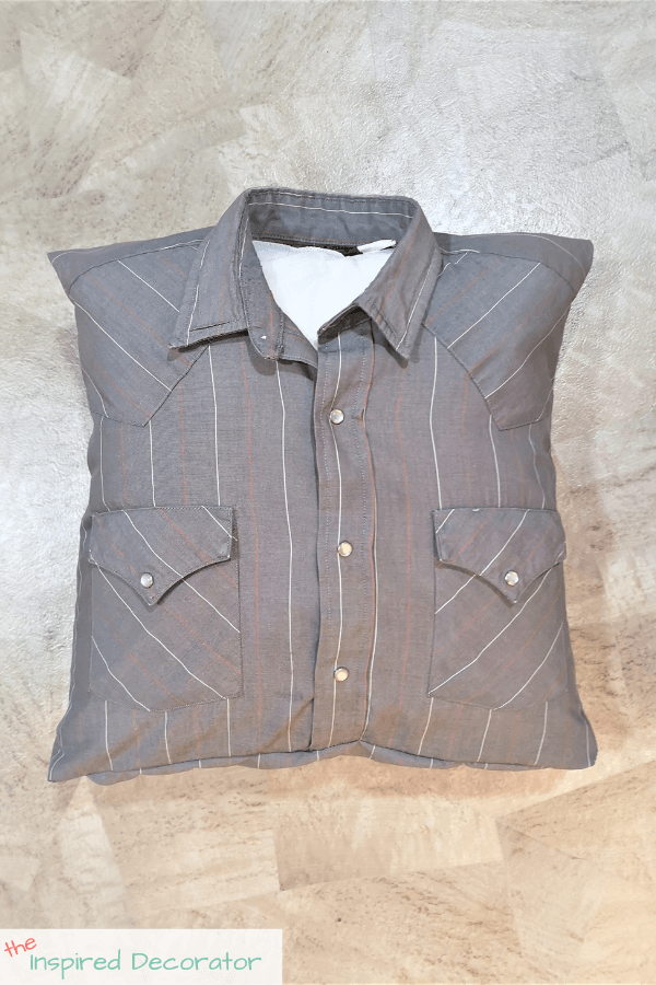 A memory pillow made from a loved ones' grey shirt.