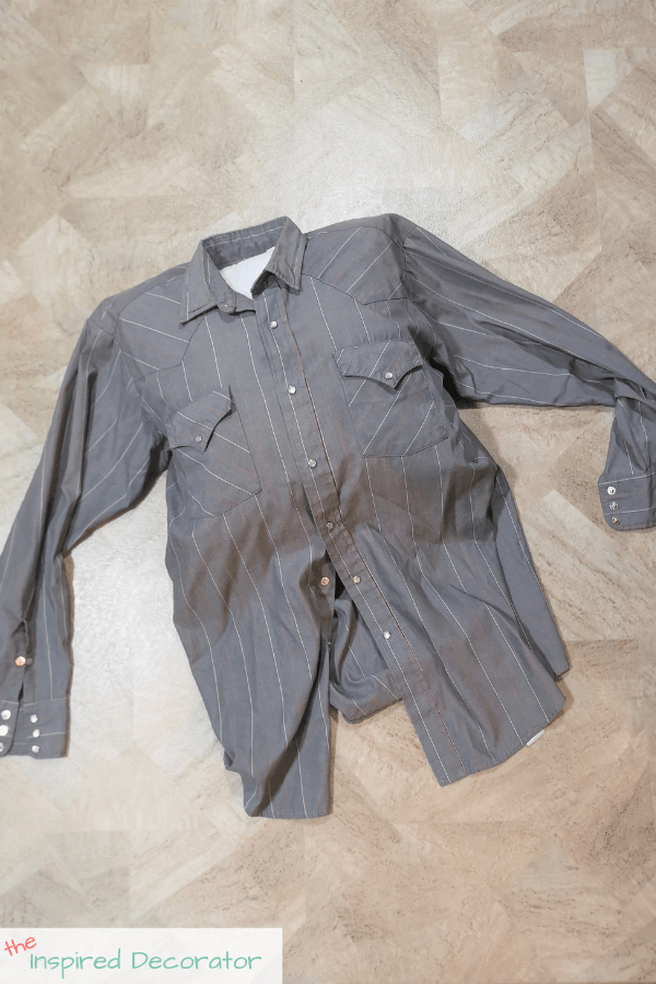 Insert the pillow inside the shirt to get it centered how you desire.